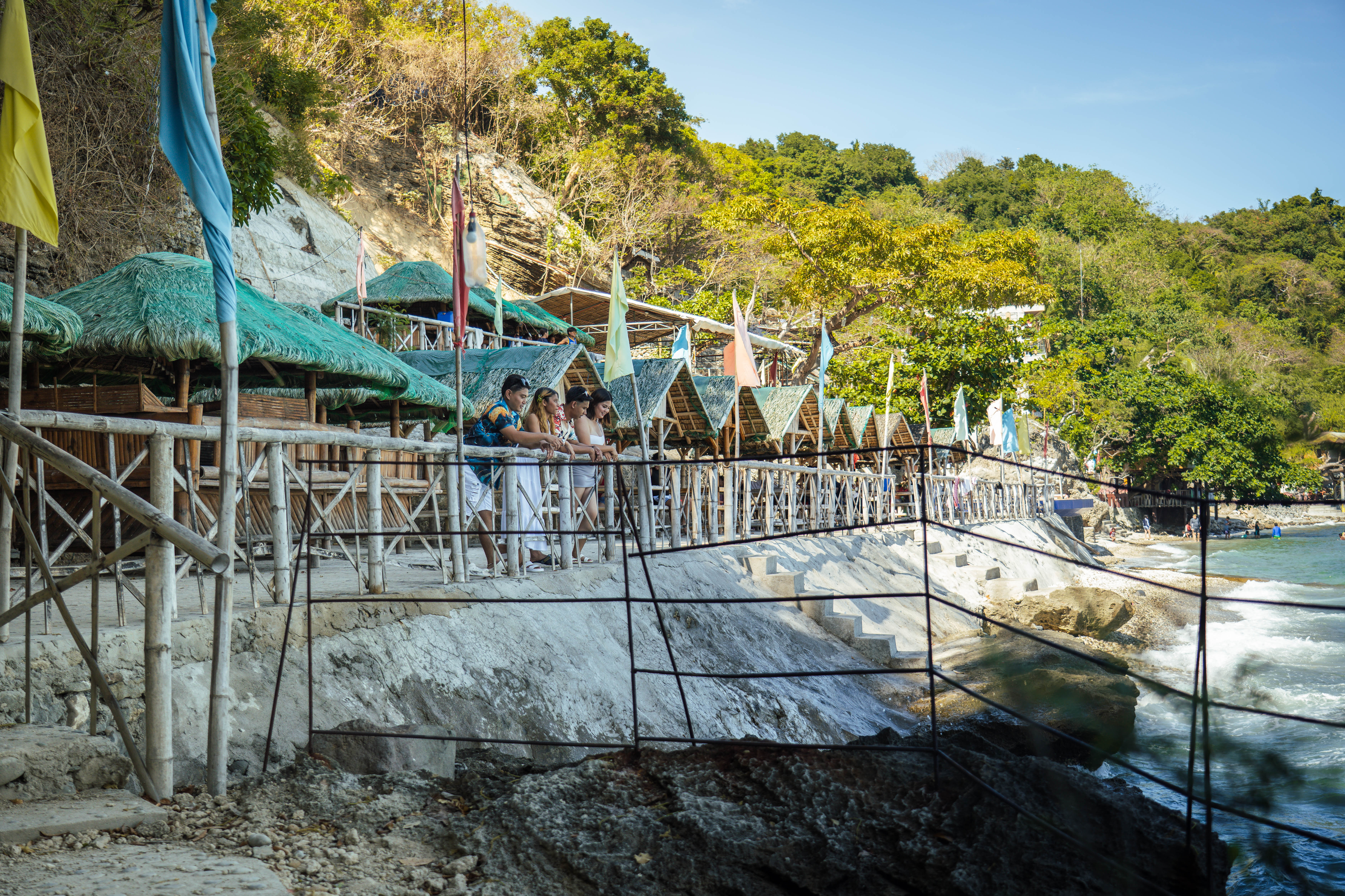 Beachfront bamboo cabanas and walkway overlooking the sea at Brizamar Beach Resort Ilihan Batangas City