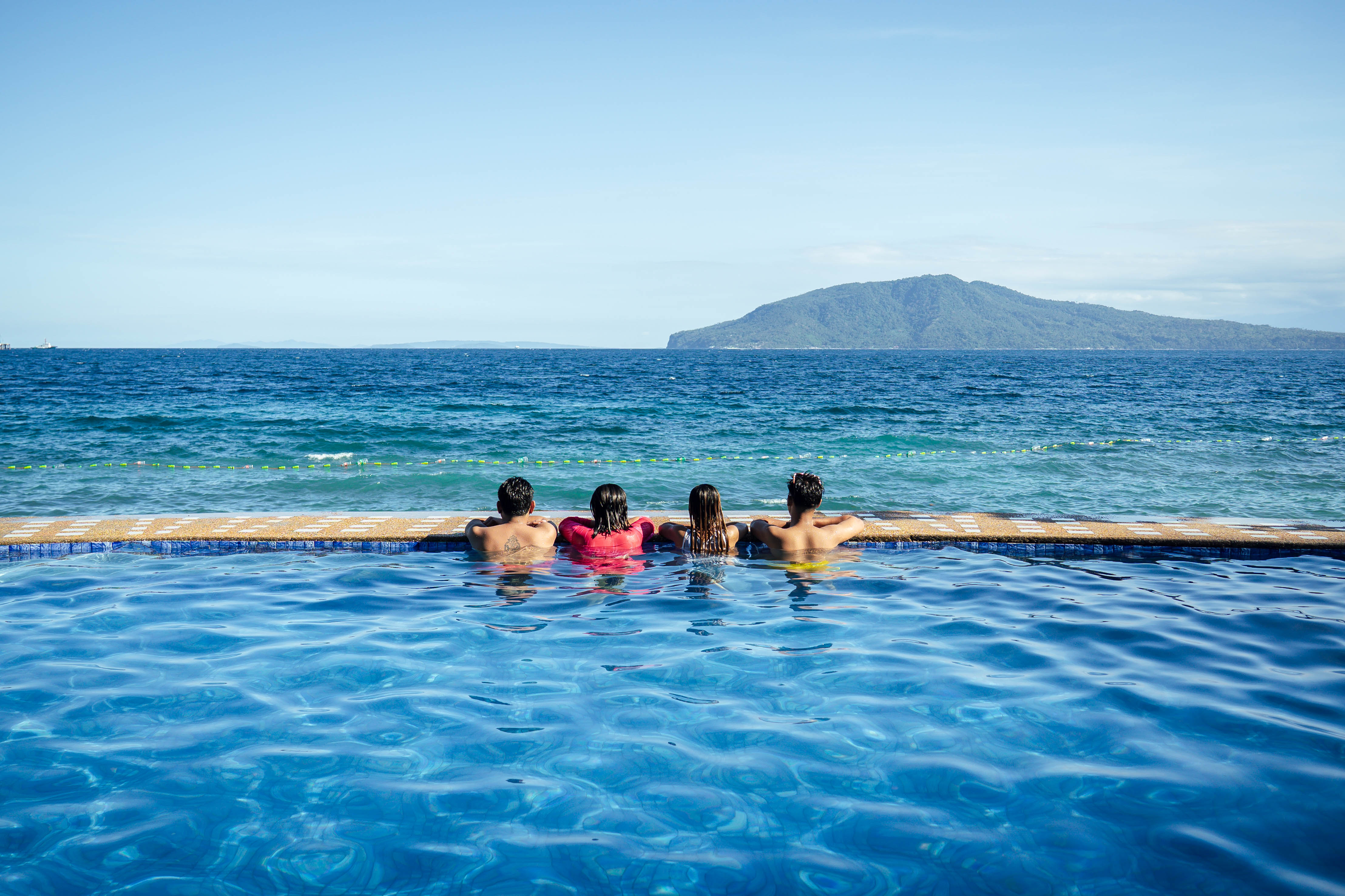 Infinity pool with panoramic ocean and mountain views at Brizamar Beach Resort Batangas